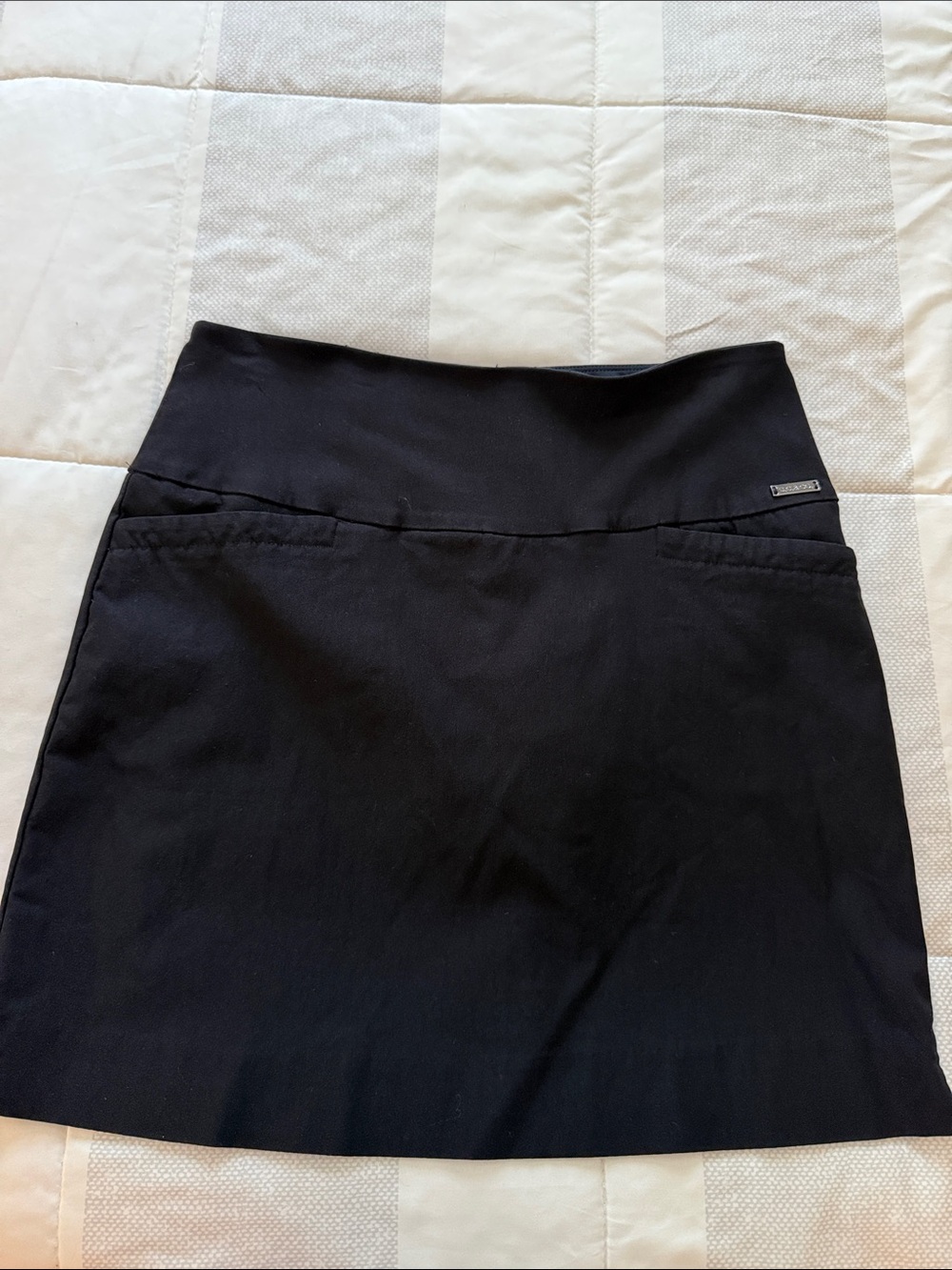 Classic Black Mini Skirt with Subtle Logo Detail